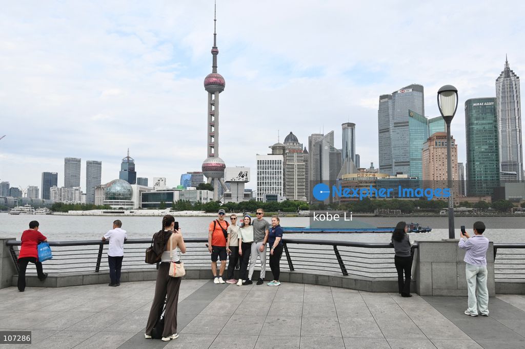 Tourists traveling at the Bund and posing photo with the Oriental Pearl Tower on October 16, 2026 in Shanghai, China. (Photo by kobe Li/Nexpher Images)