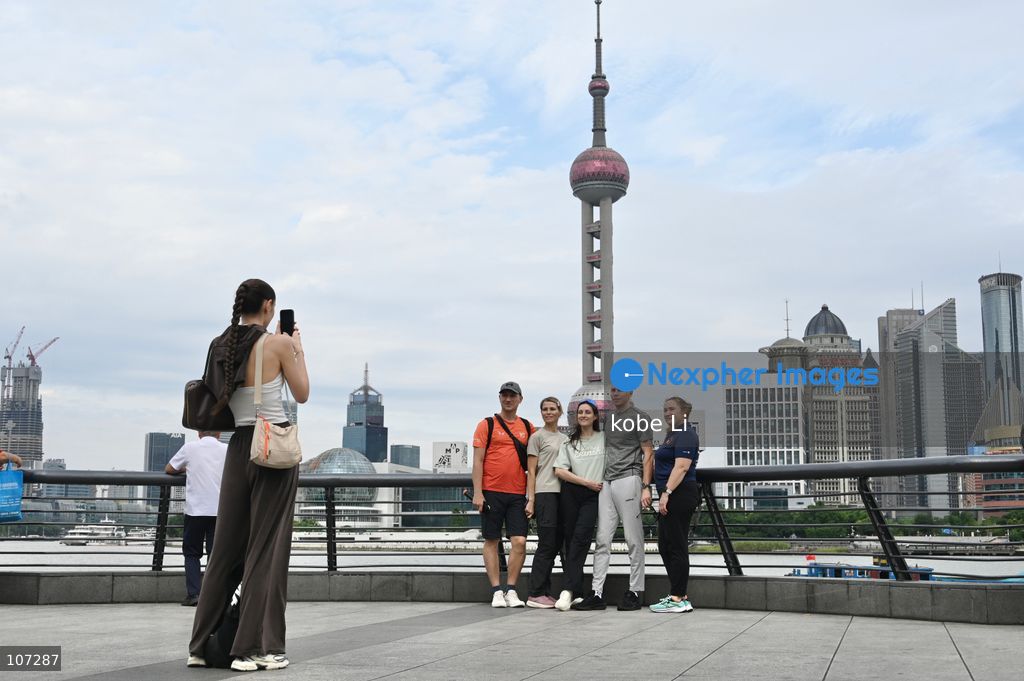 Tourists traveling at the Bund and posing photo with the Oriental Pearl Tower on October 16, 2026 in Shanghai, China. (Photo by kobe Li/Nexpher Images)