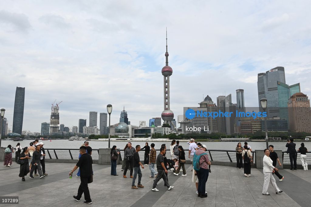 Tourists traveling at the Bund and watching the Oriental Pearl Tower on October 16, 2026 in Shanghai, China. (Photo by kobe Li/Nexpher Images)