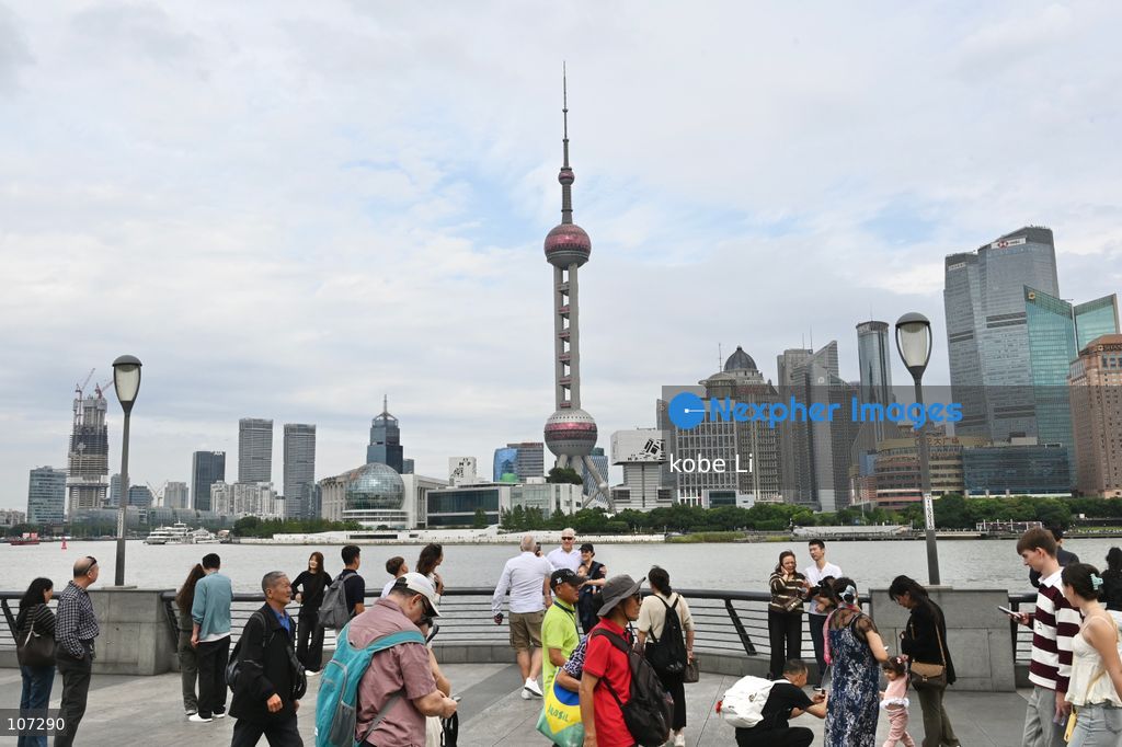 Tourists traveling at the Bund and watching the Oriental Pearl Tower on October 16, 2026 in Shanghai, China. (Photo by kobe Li/Nexpher Images)