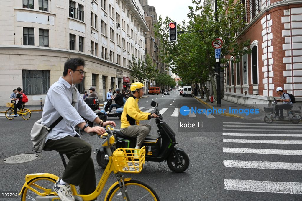 A general view showing people raiding bicyle or Electric sooter on the road on October 16, 2026 in Shanghai, China. (Photo by kobe Li/Nexpher Images)