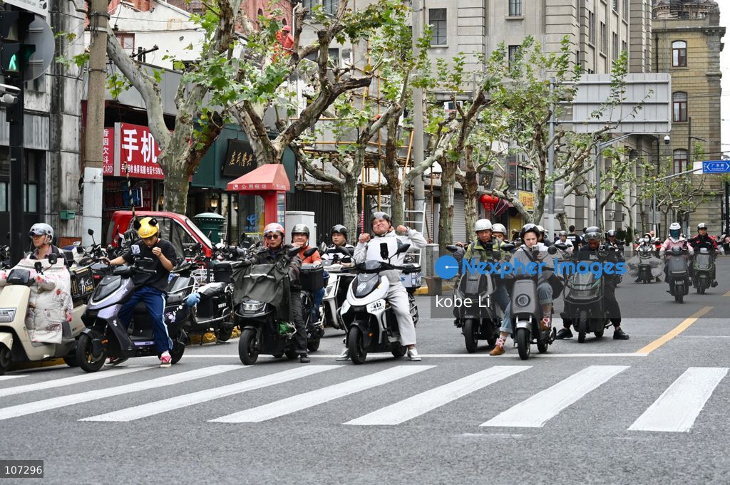 A general view showing people raiding Electric sooter on the road on October 16, 2026 in Shanghai, China. (Photo by kobe Li/Nexpher Images)