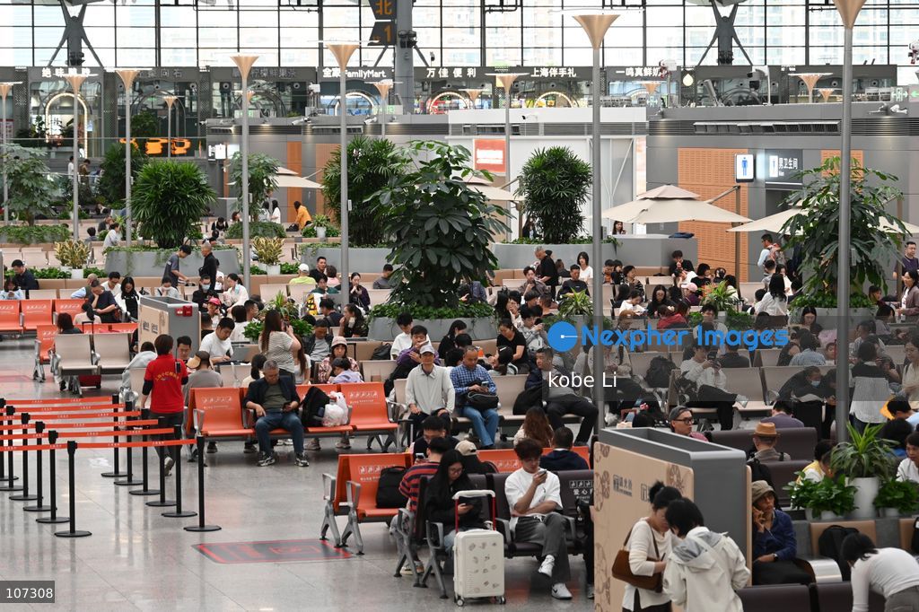 A general view showing passengers waiting at the Shanghainan Railway Station on October 16, 2026 in Shanghai, China. (Photo by kobe Li/Nexpher Images)