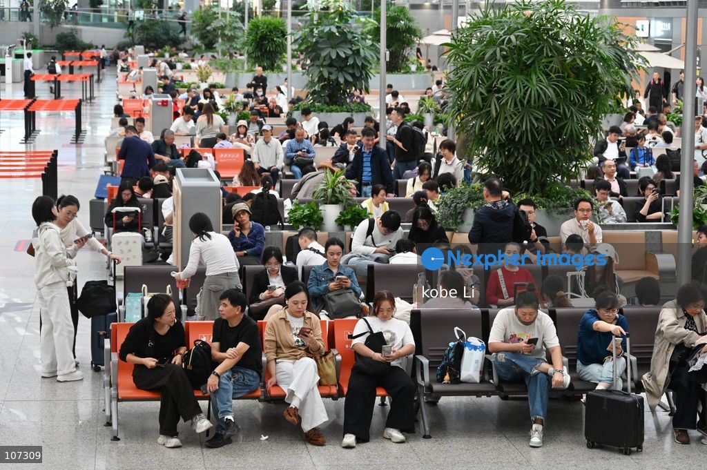 A general view showing passengers waiting at the Shanghainan Railway Station on October 16, 2026 in Shanghai, China. (Photo by kobe Li/Nexpher Images)