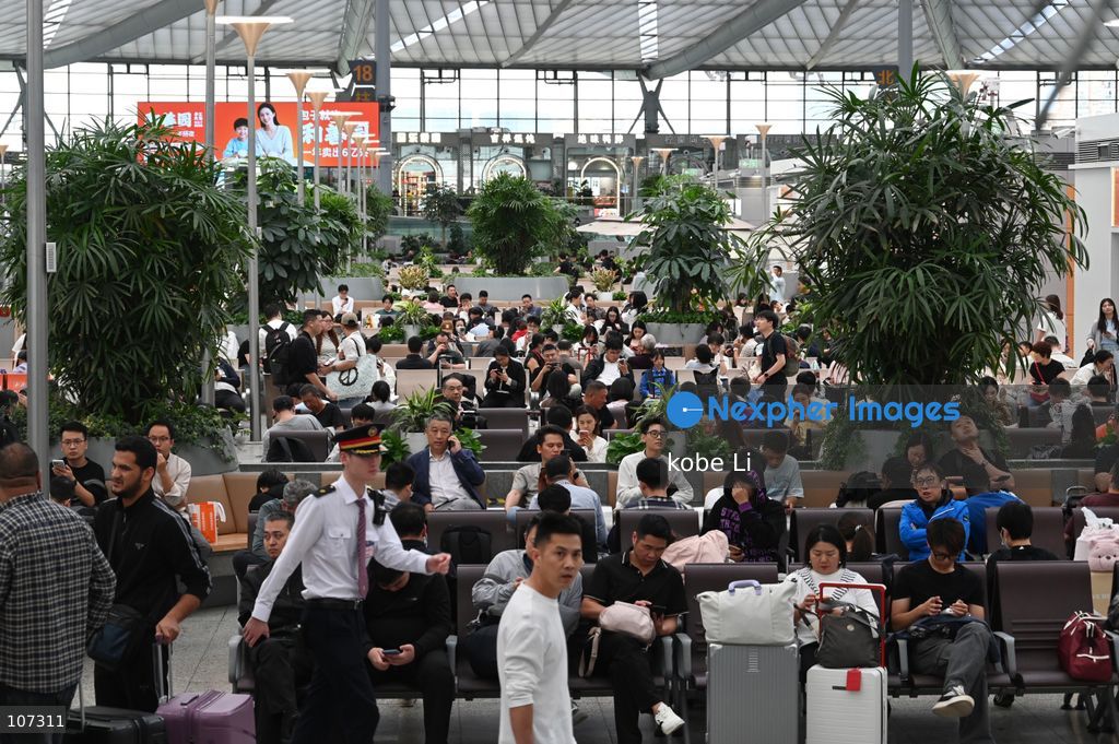 A general view showing passengers waiting at the Shanghainan Railway Station on October 16, 2026 in Shanghai, China. (Photo by kobe Li/Nexpher Images)