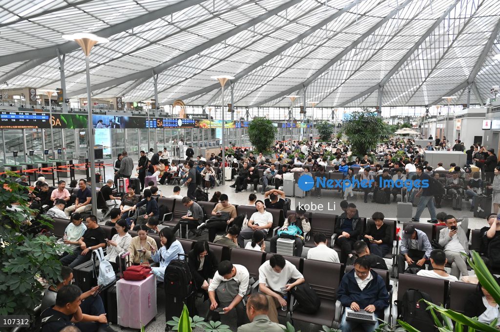 A general view showing passengers waiting at the Shanghainan Railway Station on October 16, 2026 in Shanghai, China. (Photo by kobe Li/Nexpher Images)