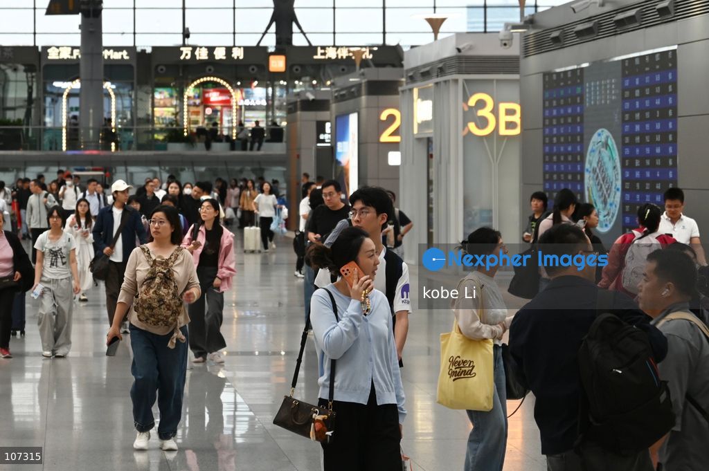 A general view showing passengers walking at the Shanghainan Railway Station on October 16, 2026 in Shanghai, China. (Photo by kobe Li/Nexpher Images)
