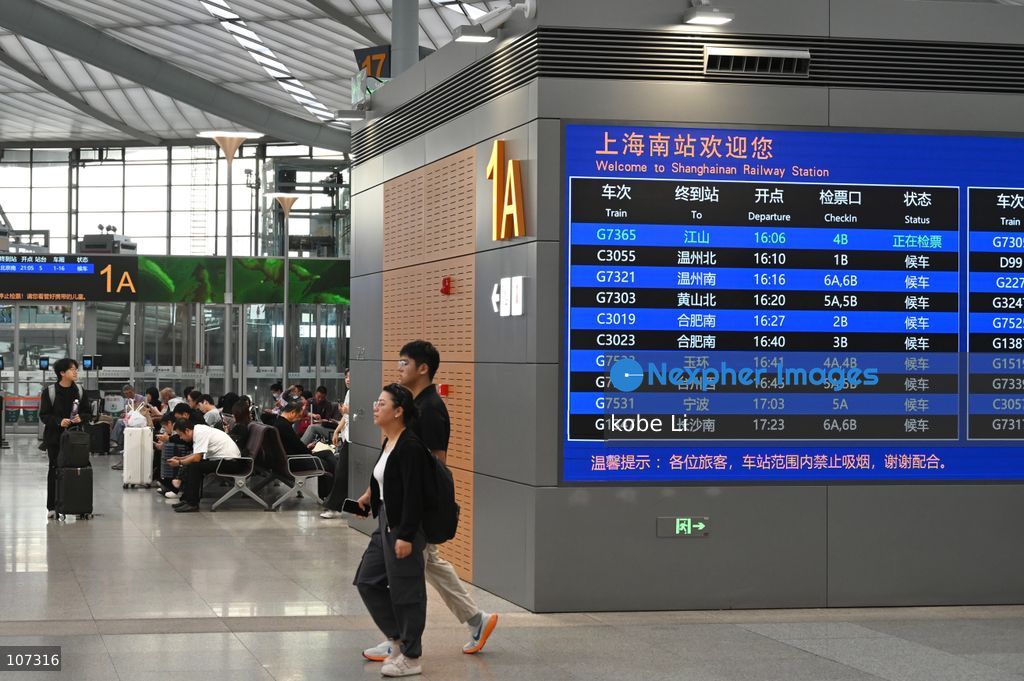 A general view showing passengers walking at the Shanghainan Railway Station on October 16, 2026 in Shanghai, China. (Photo by kobe Li/Nexpher Images)