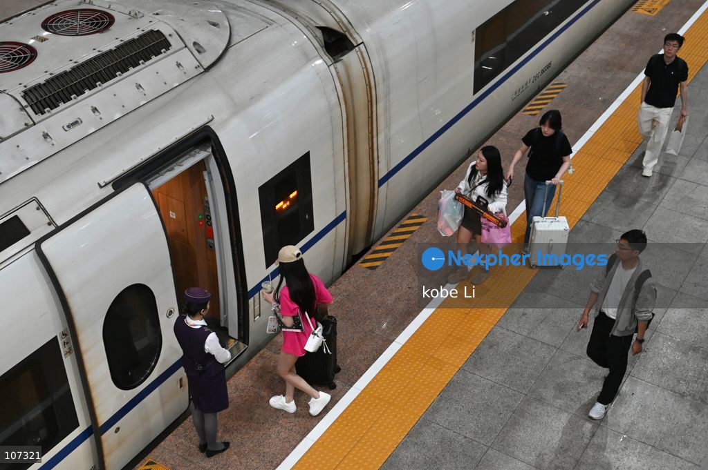 A general view showing passengers getting to the train at the Shanghainan Railway Station on October 16, 2026 in Shanghai, China. (Photo by kobe Li/Nexpher Images)