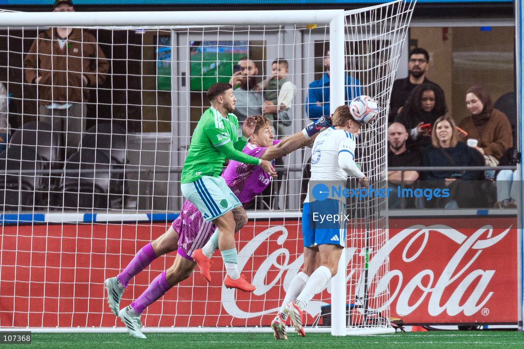 Brandan Craig #5 and Sébastian Breza #1 of CF Montréal, and Paul Arriola #17 of Seattle Sounders FC battle for the ball during the MLS match between Sounders FC and CF Montréal at Lumen Field. on October 17, 2026 in Seattle, Washington. (Photo by Jules Doyle / Eyepix Group/Eyepix via Nexpher Images)