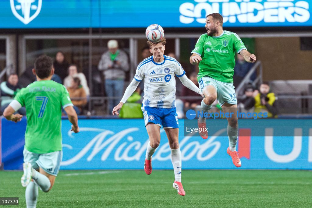 Brandan Craig #5 of CF Montréal and Jordan Morris #13 of Seattle Sounders FC battle for the header during the MLS match between Sounders FC and CF Montréal at Lumen Field. on October 17, 2026 in Seattle, Washington. (Photo by Jules Doyle / Eyepix Group/Eyepix via Nexpher Images)