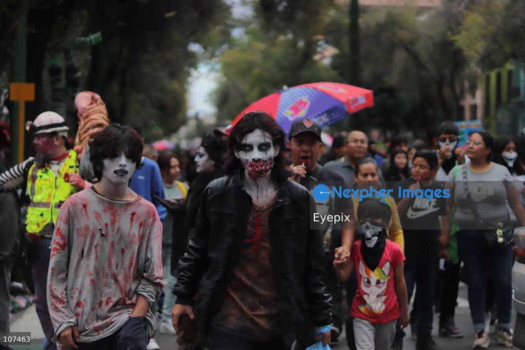 Participants disguised as zombies take part in the 19th annual "Zombie Walk Mexico" (Marcha Zombie) along Reforma Avenue. Thousands of people dressed up as the undead gathered for the annual parade for Halloween celebrations on October 18, 2026 in Mexico City, Mexico. (Photo by Carlos Santiago/ Eyepix Group/Eyepix via Nexpher Images)