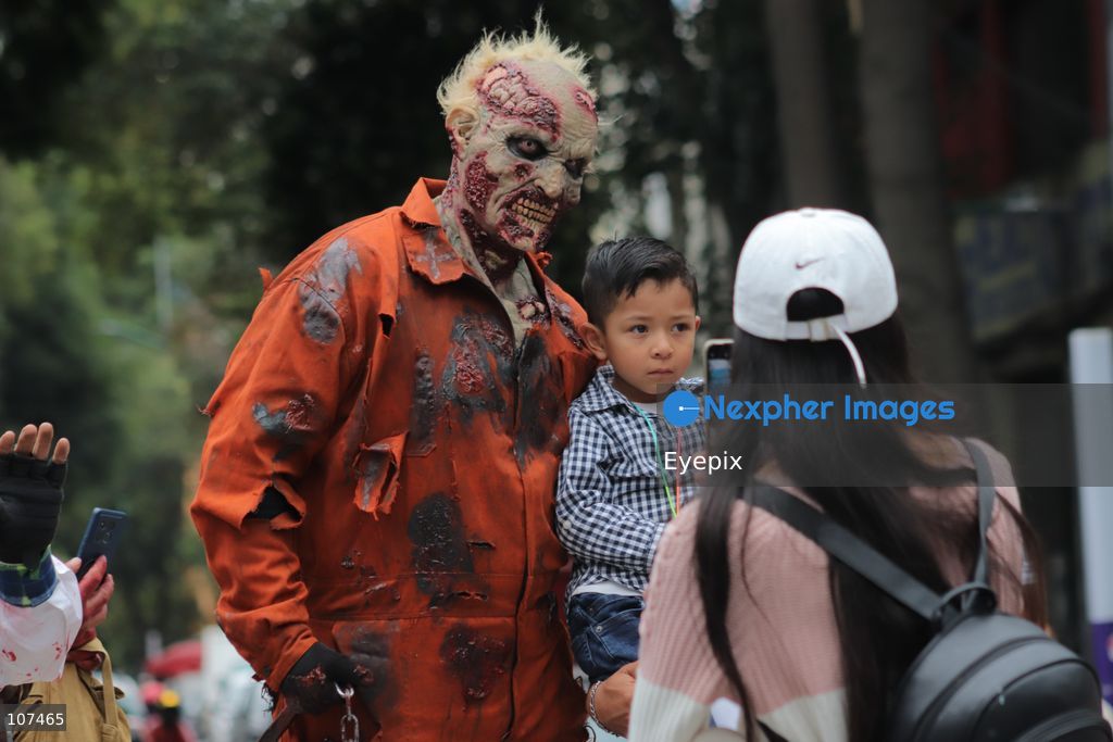 A participant disguised as zombie takes part in the 19th annual "Zombie Walk Mexico" (Marcha Zombie) along Reforma Avenue. Thousands of people dressed up as the undead gathered for the annual parade for Halloween celebrations on October 18, 2026 in Mexico City, Mexico. (Photo by Carlos Santiago/ Eyepix Group/Eyepix via Nexpher Images)