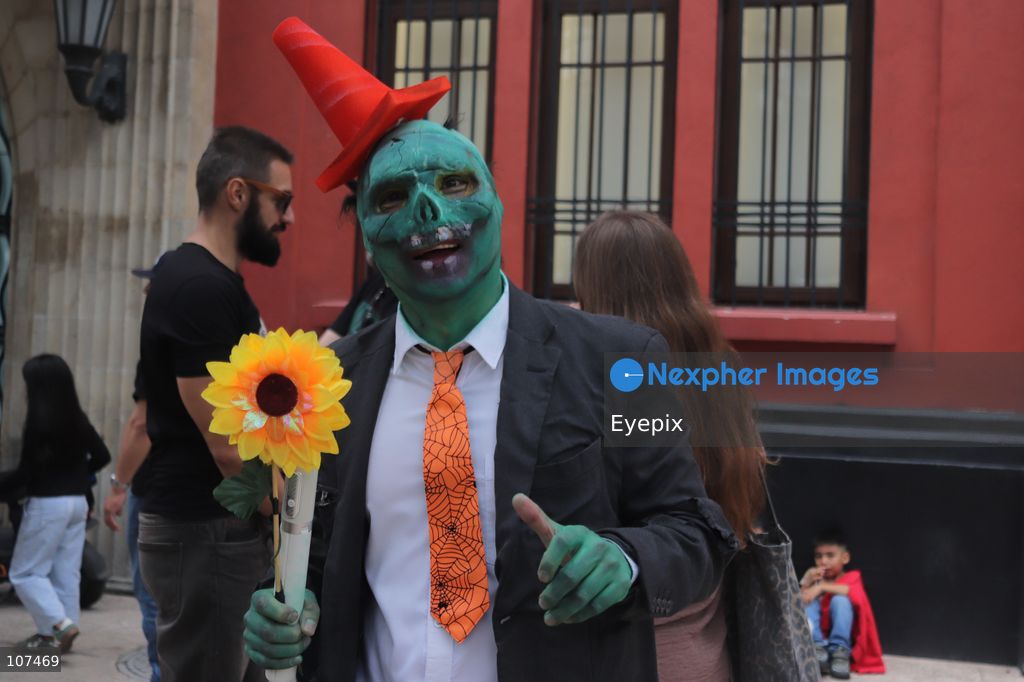 A participant disguised as character from plats v zombies video game takes part in the 19th annual "Zombie Walk Mexico" (Marcha Zombie) along Reforma Avenue. Thousands of people dressed up as the undead gathered for the annual parade for Halloween celebrations on October 18, 2026 in Mexico City, Mexico. (Photo by Carlos Santiago/ Eyepix Group/Eyepix via Nexpher Images)