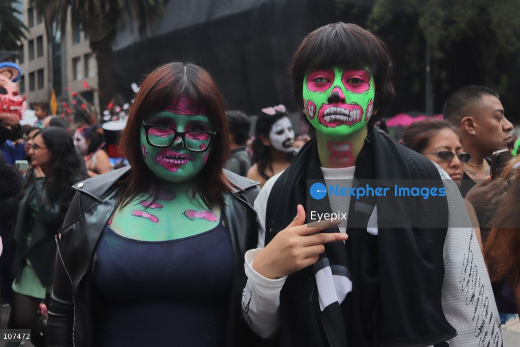 Participants with their faces made up take part in the 19th annual "Zombie Walk Mexico" (Marcha Zombie) along Reforma Avenue. Thousands of people dressed up as the undead gathered for the annual parade for Halloween celebrations on October 18, 2026 in Mexico City, Mexico. (Photo by Carlos Santiago/ Eyepix Group/Eyepix via Nexpher Images)