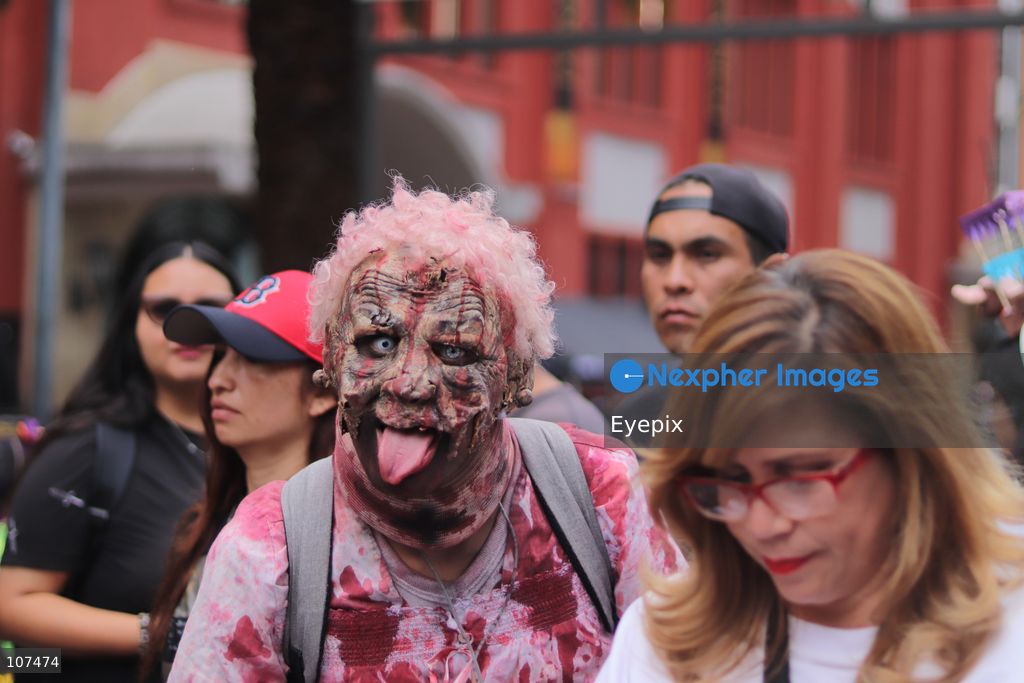 A participant disguised as zombie takes part in the 19th annual "Zombie Walk Mexico" (Marcha Zombie) along Reforma Avenue. Thousands of people dressed up as the undead gathered for the annual parade for Halloween celebrations on October 18, 2026 in Mexico City, Mexico. (Photo by Carlos Santiago/ Eyepix Group/Eyepix via Nexpher Images)