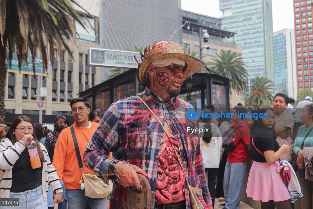 A participant disguised as zombie takes part in the 19th annual "Zombie Walk Mexico" (Marcha Zombie) along Reforma Avenue. Thousands of people dressed up as the undead gathered for the annual parade for Halloween celebrations on October 18, 2026 in Mexico City, Mexico. (Photo by Carlos Santiago/ Eyepix Group/Eyepix via Nexpher Images)