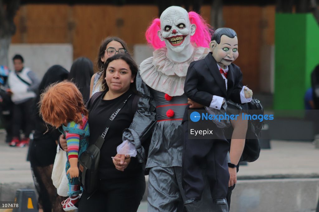 A participant disguised as a diabolical clown takes part in the 19th annual "Zombie Walk Mexico" (Marcha Zombie) along Reforma Avenue. Thousands of people dressed up as the undead gathered for the annual parade for Halloween celebrations on October 18, 2026 in Mexico City, Mexico. (Photo by Carlos Santiago/ Eyepix Group/Eyepix via Nexpher Images)
