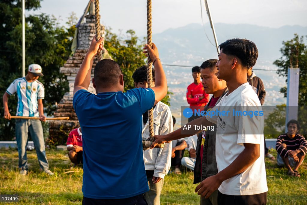Bhaktapur, NEPAL, October 19, 2026: People enjoy playing on a traditional bamboo swing (Linge Ping) during the Dashain festival in Bhaktapur, Nepal (Photo by AP Tolang/Nexpher Images)