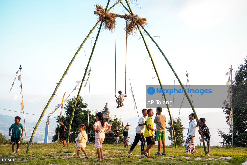 Bhaktapur, NEPAL, October 19, 2026: People enjoy playing on a traditional bamboo swing (Linge Ping) during the Dashain festival in Bhaktapur, Nepal (Photo by AP Tolang/Nexpher Images)