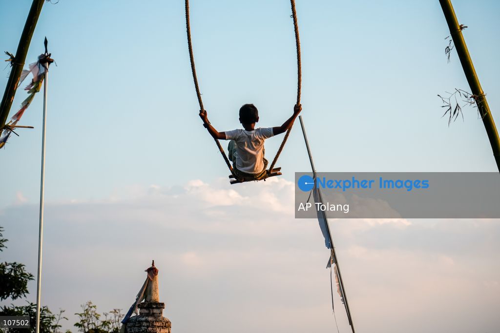 Bhaktapur, NEPAL, October 19, 2026: People enjoy playing on a traditional bamboo swing (Linge Ping) during the Dashain festival in Bhaktapur, Nepal (Photo by AP Tolang/Nexpher Images)