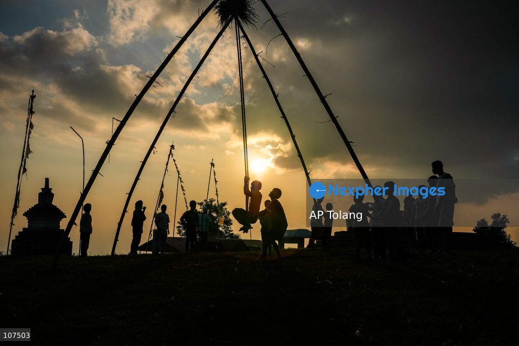 Bhaktapur, NEPAL, October 19, 2026: People enjoy playing on a traditional bamboo swing (Linge Ping) during the Dashain festival in Bhaktapur, Nepal (Photo by AP Tolang/Nexpher Images)