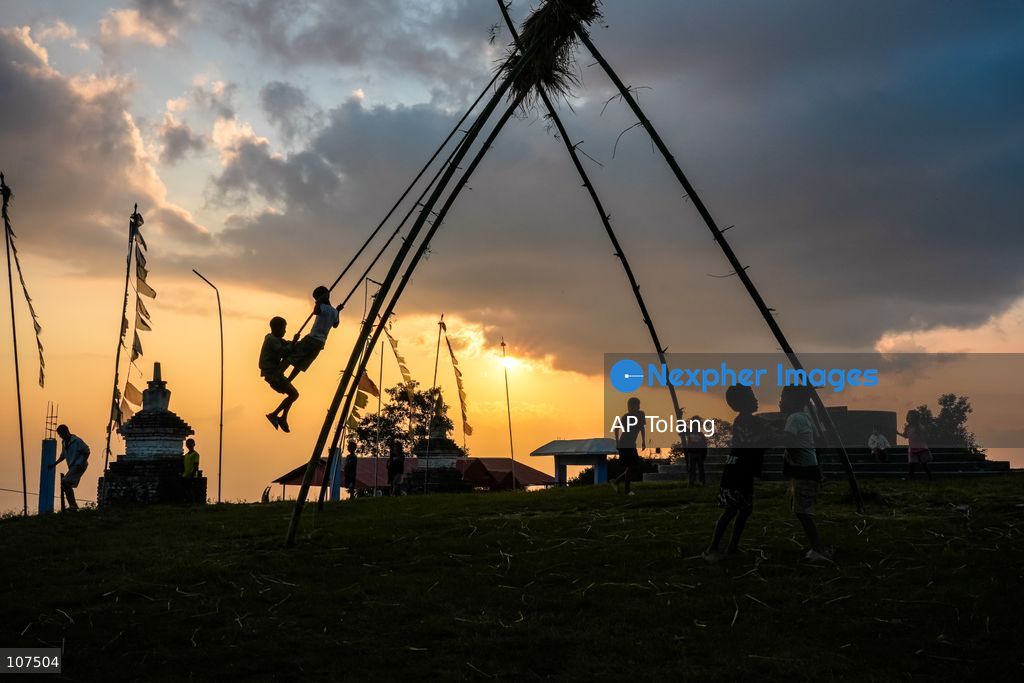 Bhaktapur, NEPAL, October 19, 2026: People enjoy playing on a traditional bamboo swing (Linge Ping) during the Dashain festival in Bhaktapur, Nepal (Photo by AP Tolang/Nexpher Images)