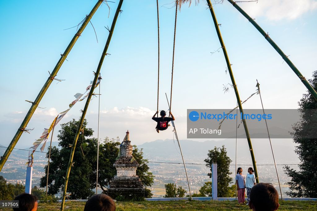 Bhaktapur, NEPAL, October 19, 2026: People enjoy playing on a traditional bamboo swing (Linge Ping) during the Dashain festival in Bhaktapur, Nepal (Photo by AP Tolang/Nexpher Images)