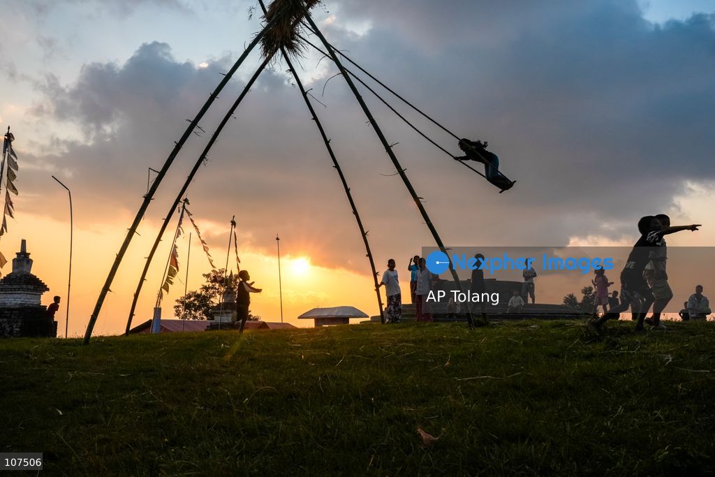Bhaktapur, NEPAL, October 19, 2026: People enjoy playing on a traditional bamboo swing (Linge Ping) during the Dashain festival in Bhaktapur, Nepal (Photo by AP Tolang/Nexpher Images)