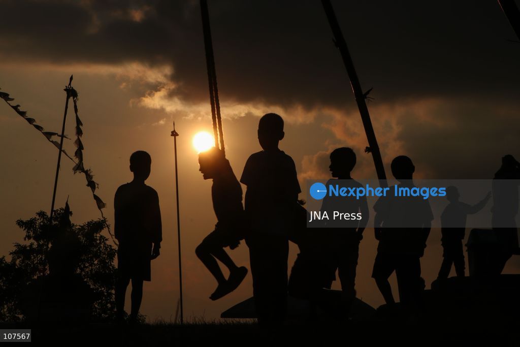BHAKTAPUR, NEPAL, OCTOBER 19, 2026: People play on a traditional bamboo swing, known as linge ping, during Dashain celebrations in the hilly outskirts of the Kathmandu Valley. Such swings are erected in communities across Nepal as part of the festival’s traditions. (Photo by Shankar Bhujel/JNA Press via Nexpher Images)