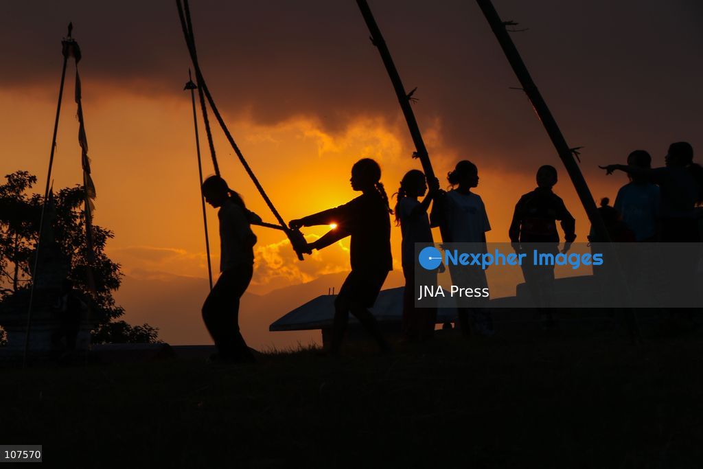 BHAKTAPUR, NEPAL, OCTOBER 19, 2026: People play on a traditional bamboo swing, known as linge ping, during Dashain celebrations in the hilly outskirts of the Kathmandu Valley. Such swings are erected in communities across Nepal as part of the festival’s traditions. (Photo by Shankar Bhujel/JNA Press via Nexpher Images)