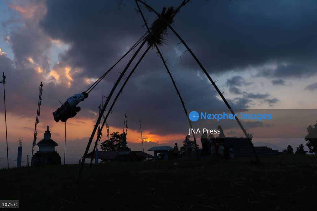 BHAKTAPUR, NEPAL, OCTOBER 19, 2026: People play on a traditional bamboo swing, known as linge ping, during Dashain celebrations in the hilly outskirts of the Kathmandu Valley. Such swings are erected in communities across Nepal as part of the festival’s traditions. (Photo by Shankar Bhujel/JNA Press via Nexpher Images)