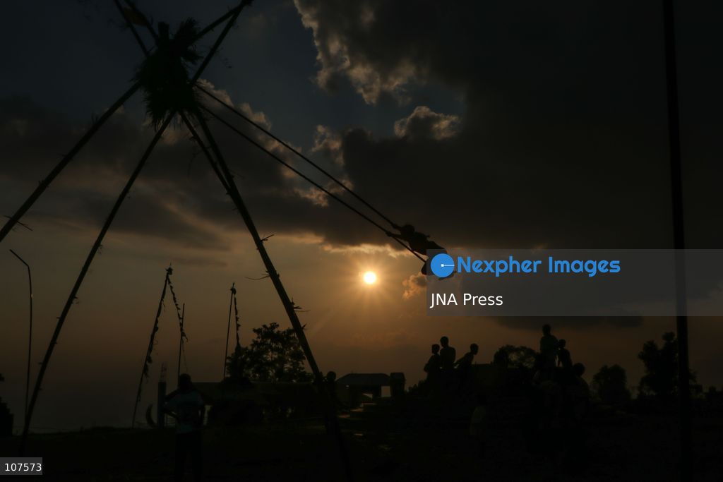BHAKTAPUR, NEPAL, OCTOBER 19, 2026: People play on a traditional bamboo swing, known as linge ping, during Dashain celebrations in the hilly outskirts of the Kathmandu Valley. Such swings are erected in communities across Nepal as part of the festival’s traditions. (Photo by Shankar Bhujel/JNA Press via Nexpher Images)