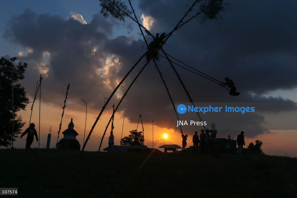 BHAKTAPUR, NEPAL, OCTOBER 19, 2026: People play on a traditional bamboo swing, known as linge ping, during Dashain celebrations in the hilly outskirts of the Kathmandu Valley. Such swings are erected in communities across Nepal as part of the festival’s traditions. (Photo by Shankar Bhujel/JNA Press via Nexpher Images)
