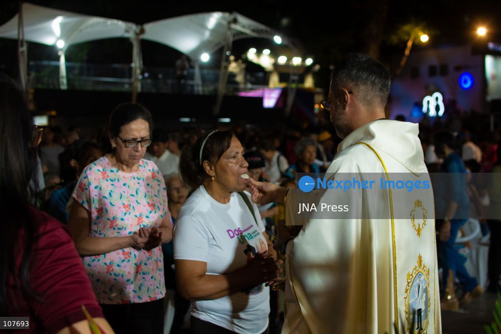 CARACAS, VENEZUELA - OCTOBER 19, 2026: Devotees light candles and pray during a spiritual procession around the church where the remains of Saint Jose Gregorio Hernandez, known as the 'Doctor of the Poor', rest, to mark the first anniversary of his canonization. Hernandez is Venezuela's first lay saint, and his popular devotion and social impact remain strong across the country. (Photo by Franyer Nieves (Babel)/JNA Press via Nexpher Images)