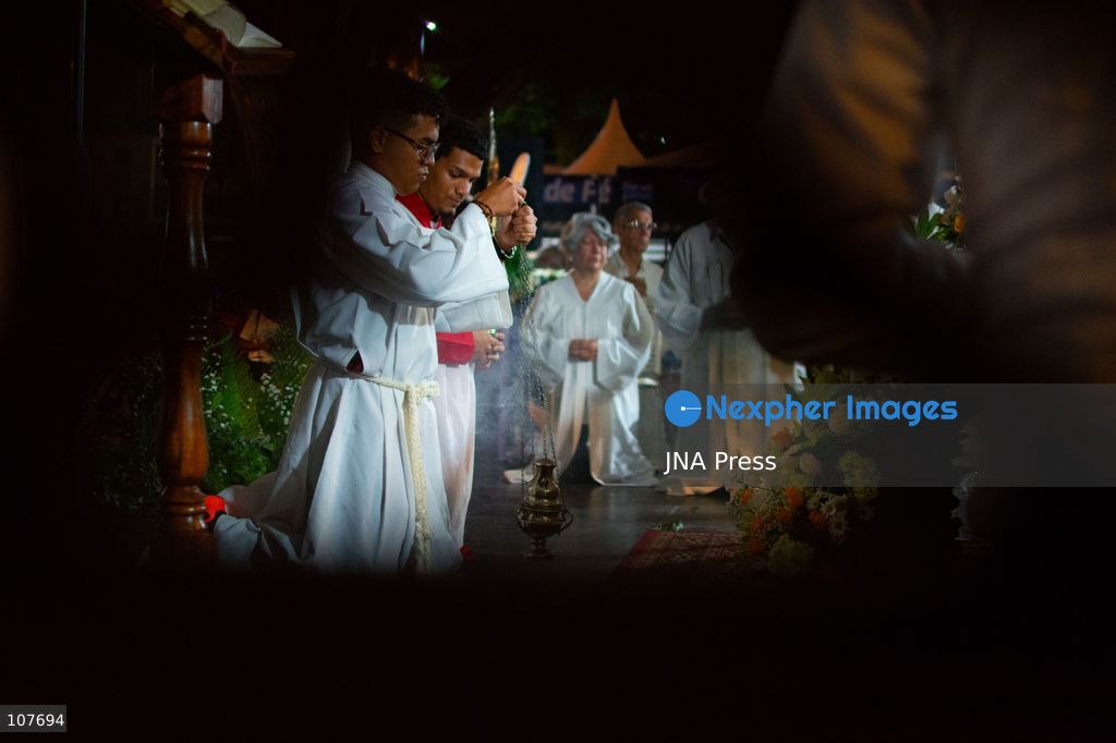 CARACAS, VENEZUELA - OCTOBER 19, 2026: Devotees light candles and pray during a spiritual procession around the church where the remains of Saint Jose Gregorio Hernandez, known as the 'Doctor of the Poor', rest, to mark the first anniversary of his canonization. Hernandez is Venezuela's first lay saint, and his popular devotion and social impact remain strong across the country. (Photo by Franyer Nieves (Babel)/JNA Press via Nexpher Images)