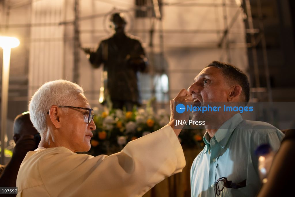 CARACAS, VENEZUELA - OCTOBER 19, 2026: Devotees light candles and pray during a spiritual procession around the church where the remains of Saint Jose Gregorio Hernandez, known as the 'Doctor of the Poor', rest, to mark the first anniversary of his canonization. Hernandez is Venezuela's first lay saint, and his popular devotion and social impact remain strong across the country. (Photo by Franyer Nieves (Babel)/JNA Press via Nexpher Images)
