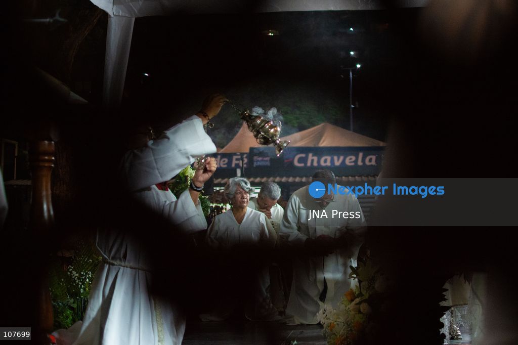 CARACAS, VENEZUELA - OCTOBER 19, 2026: Devotees light candles and pray during a spiritual procession around the church where the remains of Saint Jose Gregorio Hernandez, known as the 'Doctor of the Poor', rest, to mark the first anniversary of his canonization. Hernandez is Venezuela's first lay saint, and his popular devotion and social impact remain strong across the country. (Photo by Franyer Nieves (Babel)/JNA Press via Nexpher Images)