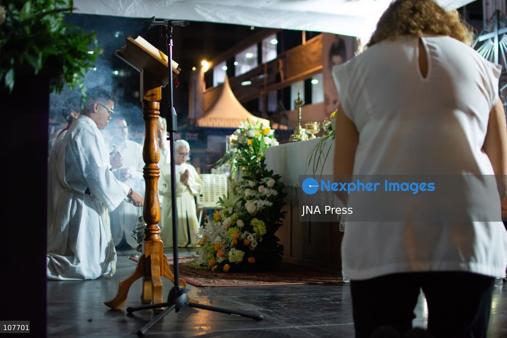 CARACAS, VENEZUELA - OCTOBER 19, 2026: Devotees light candles and pray during a spiritual procession around the church where the remains of Saint Jose Gregorio Hernandez, known as the 'Doctor of the Poor', rest, to mark the first anniversary of his canonization. Hernandez is Venezuela's first lay saint, and his popular devotion and social impact remain strong across the country. (Photo by Franyer Nieves (Babel)/JNA Press via Nexpher Images)