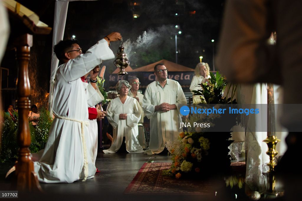 CARACAS, VENEZUELA - OCTOBER 19, 2026: Devotees light candles and pray during a spiritual procession around the church where the remains of Saint Jose Gregorio Hernandez, known as the 'Doctor of the Poor', rest, to mark the first anniversary of his canonization. Hernandez is Venezuela's first lay saint, and his popular devotion and social impact remain strong across the country. (Photo by Franyer Nieves (Babel)/JNA Press via Nexpher Images)