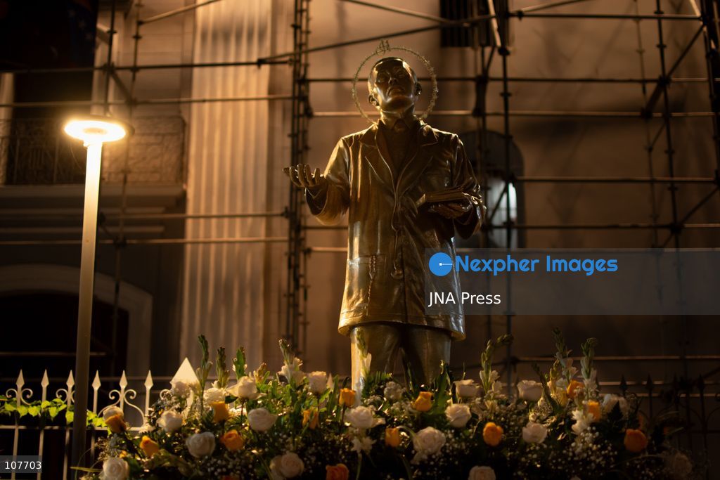 CARACAS, VENEZUELA - OCTOBER 19, 2026: Devotees light candles and pray during a spiritual procession around the church where the remains of Saint Jose Gregorio Hernandez, known as the 'Doctor of the Poor', rest, to mark the first anniversary of his canonization. Hernandez is Venezuela's first lay saint, and his popular devotion and social impact remain strong across the country. (Photo by Franyer Nieves (Babel)/JNA Press via Nexpher Images)