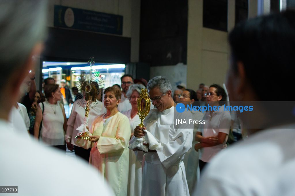 CARACAS, VENEZUELA - OCTOBER 19, 2026: Devotees light candles and pray during a spiritual procession around the church where the remains of Saint Jose Gregorio Hernandez, known as the 'Doctor of the Poor', rest, to mark the first anniversary of his canonization. Hernandez is Venezuela's first lay saint, and his popular devotion and social impact remain strong across the country. (Photo by Franyer Nieves (Babel)/JNA Press via Nexpher Images)