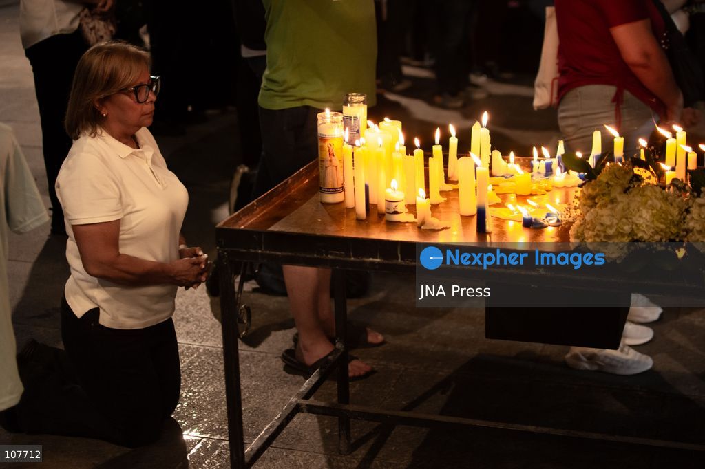 CARACAS, VENEZUELA - OCTOBER 19, 2026: Devotees light candles and pray during a spiritual procession around the church where the remains of Saint Jose Gregorio Hernandez, known as the 'Doctor of the Poor', rest, to mark the first anniversary of his canonization. Hernandez is Venezuela's first lay saint, and his popular devotion and social impact remain strong across the country. (Photo by Franyer Nieves (Babel)/JNA Press via Nexpher Images)