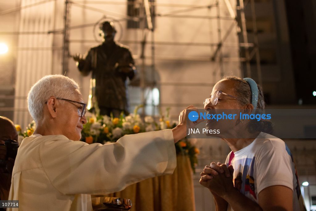 CARACAS, VENEZUELA - OCTOBER 19, 2026: Devotees light candles and pray during a spiritual procession around the church where the remains of Saint Jose Gregorio Hernandez, known as the 'Doctor of the Poor', rest, to mark the first anniversary of his canonization. Hernandez is Venezuela's first lay saint, and his popular devotion and social impact remain strong across the country. (Photo by Franyer Nieves (Babel)/JNA Press via Nexpher Images)
