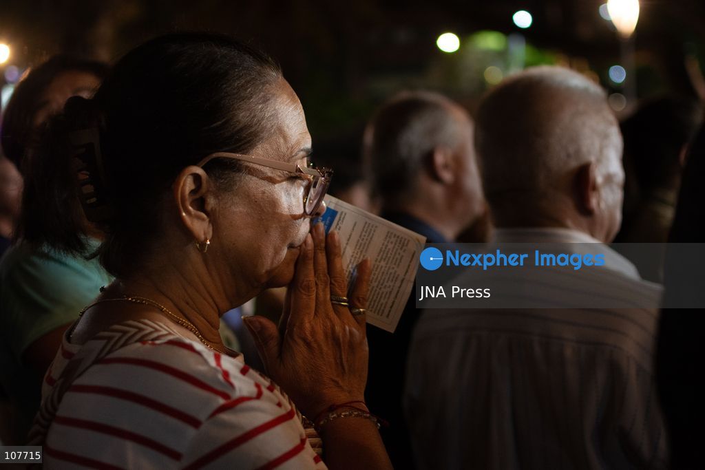 CARACAS, VENEZUELA - OCTOBER 19, 2026: Devotees light candles and pray during a spiritual procession around the church where the remains of Saint Jose Gregorio Hernandez, known as the 'Doctor of the Poor', rest, to mark the first anniversary of his canonization. Hernandez is Venezuela's first lay saint, and his popular devotion and social impact remain strong across the country. (Photo by Franyer Nieves (Babel)/JNA Press via Nexpher Images)