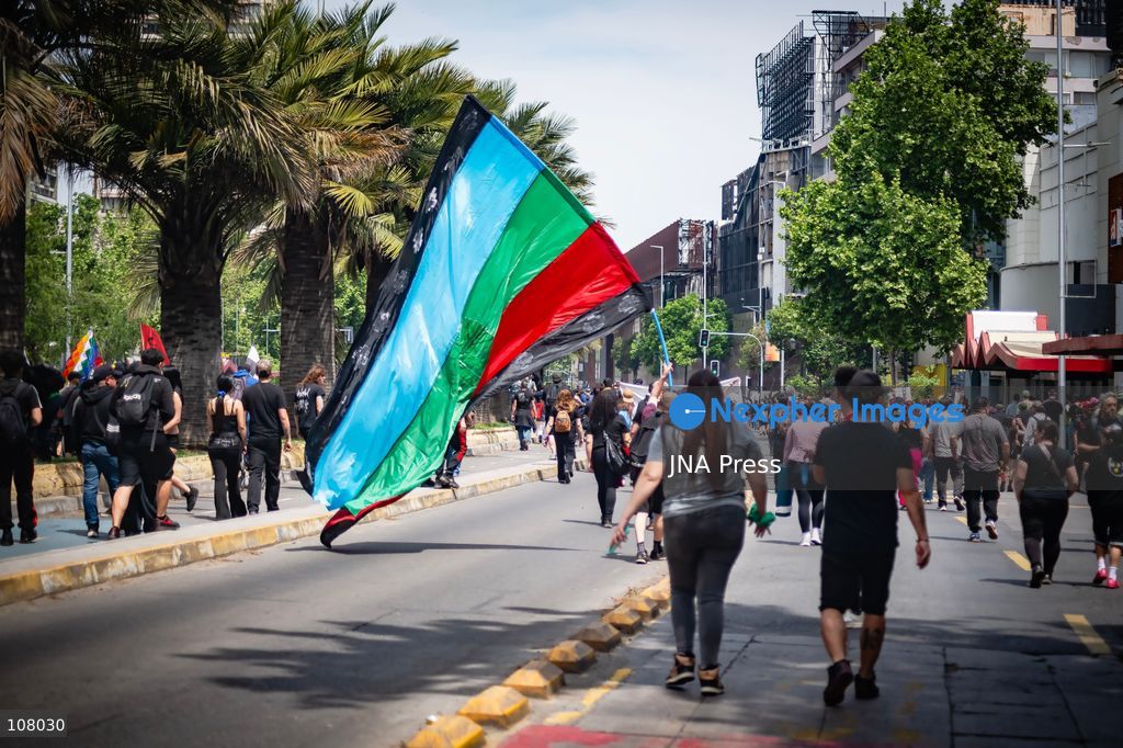 SANTIAGO, CHILE, OCTOBER 19, 2026: Demonstrators march in Santiago to mark the seventh anniversary of Chile’s 2019 social uprising, known as the “estallido social.” The movement began with protests against increased metro fares and developed into nationwide demonstrations over inequality, the cost of living and access to public services. (Photo by Mauro Arlegui/JNA Press via Nexpher Images)