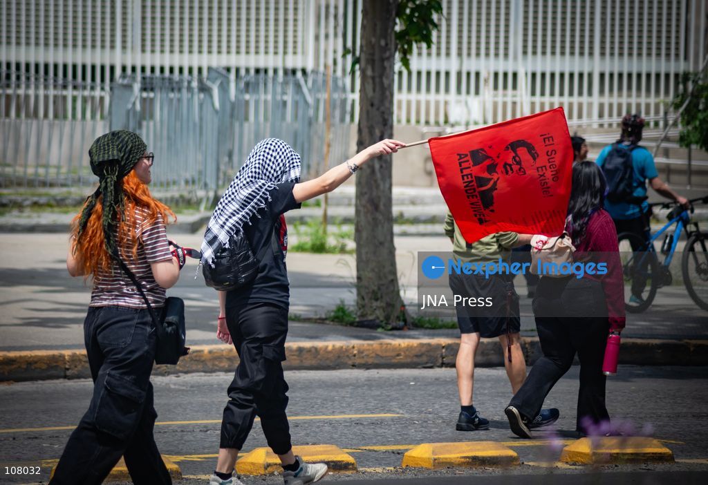 SANTIAGO, CHILE, OCTOBER 19, 2026: Demonstrators march in Santiago to mark the seventh anniversary of Chile’s 2019 social uprising, known as the “estallido social.” The movement began with protests against increased metro fares and developed into nationwide demonstrations over inequality, the cost of living and access to public services. (Photo by Mauro Arlegui/JNA Press via Nexpher Images)