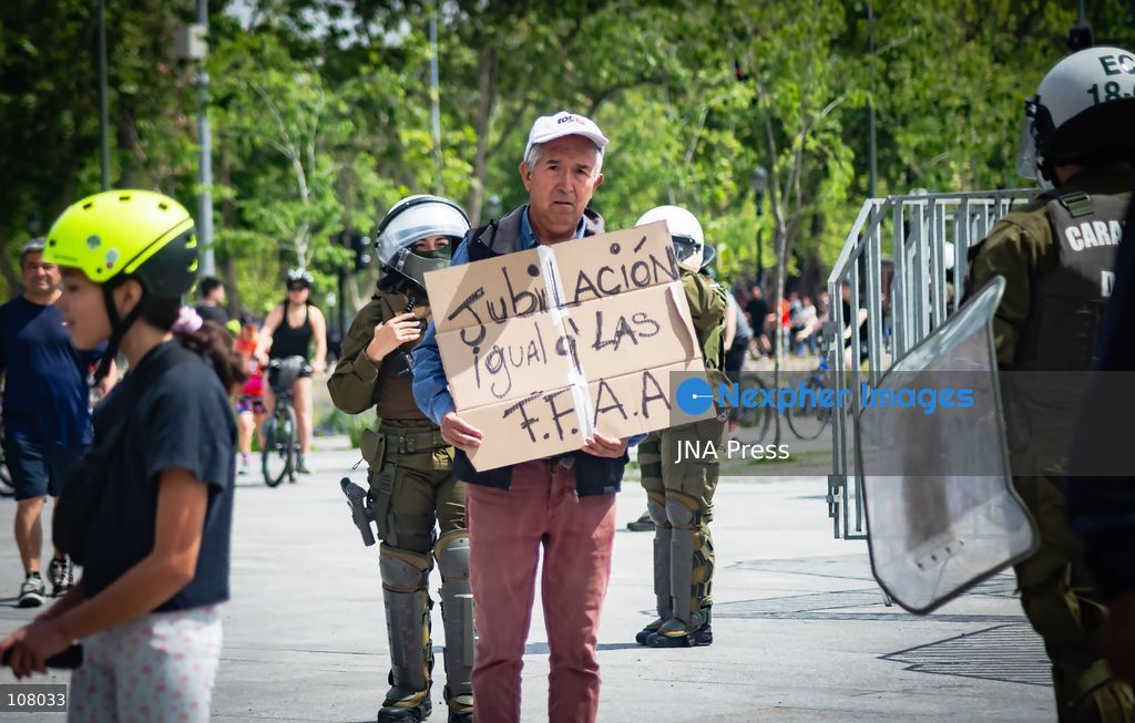 SANTIAGO, CHILE, OCTOBER 19, 2026: Demonstrators march in Santiago to mark the seventh anniversary of Chile’s 2019 social uprising, known as the “estallido social.” The movement began with protests against increased metro fares and developed into nationwide demonstrations over inequality, the cost of living and access to public services. (Photo by Mauro Arlegui/JNA Press via Nexpher Images)