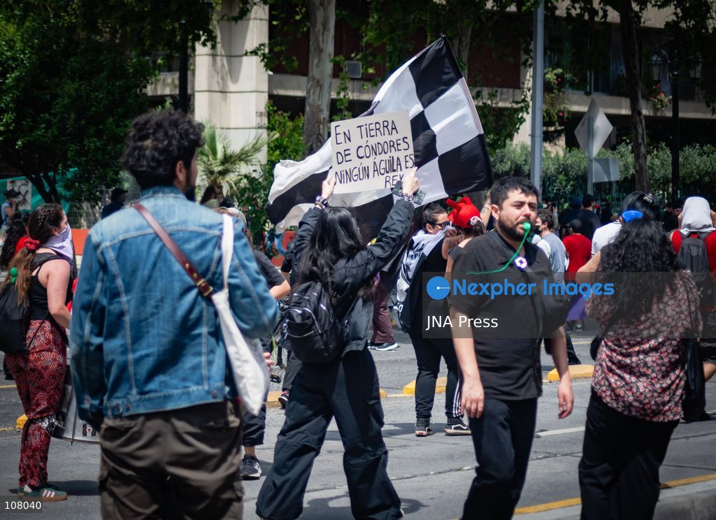SANTIAGO, CHILE, OCTOBER 19, 2026: Demonstrators march in Santiago to mark the seventh anniversary of Chile’s 2019 social uprising, known as the “estallido social.” The movement began with protests against increased metro fares and developed into nationwide demonstrations over inequality, the cost of living and access to public services. (Photo by Mauro Arlegui/JNA Press via Nexpher Images)