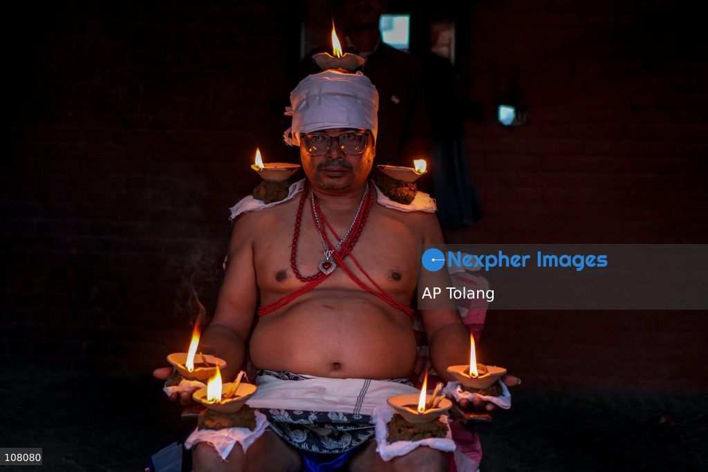 BHAKTAPUR, NEPAL – October 21, 2026: Hindu devotees perform a religious ritual by lighting oil lamps on their bodies at the premises of Brahmayani Temple during the Dashain festival in Bhaktapur, Nepal. marking Vijaya Dashami, the tenth day of Dashain, Nepal’s biggest Hindu festival. Photo by Ambir Tolang/JNA Press (Photo by AP Tolang/Nexpher Images)